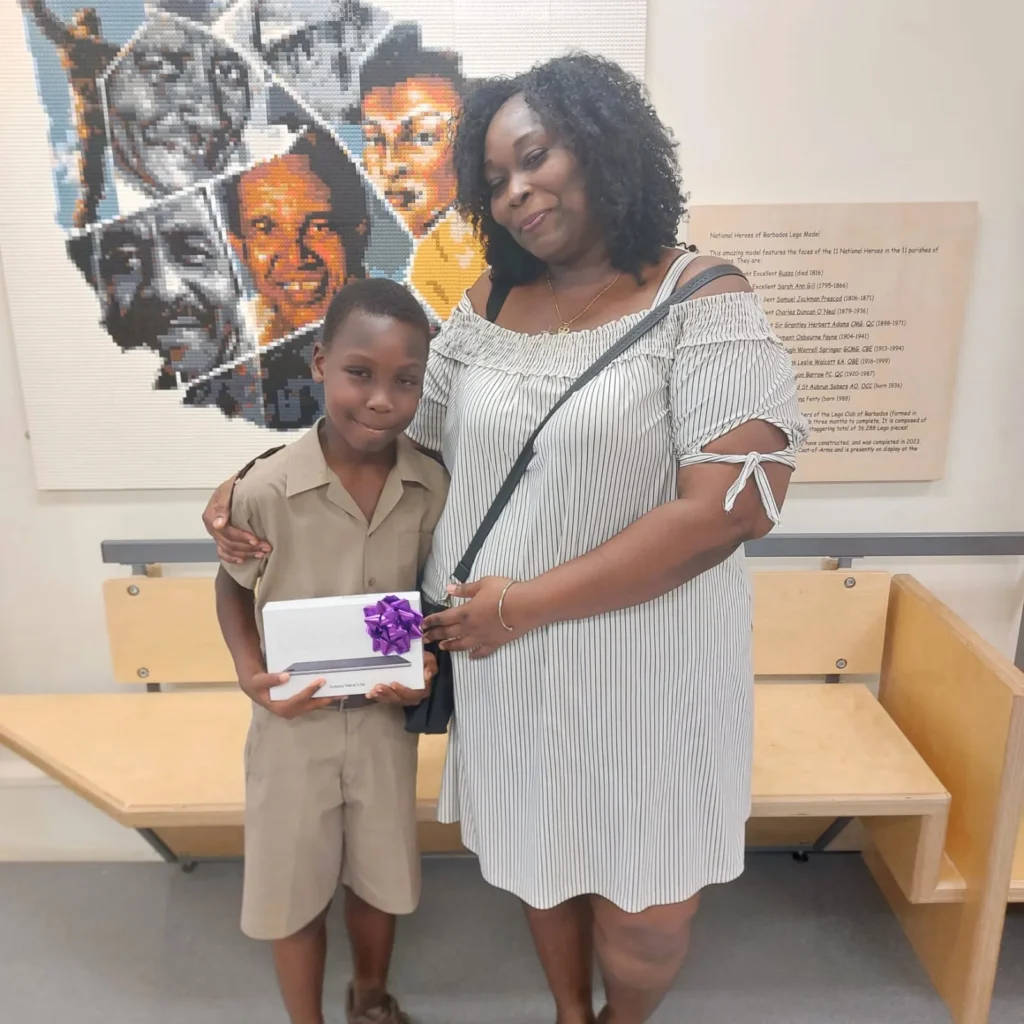 Ralando Blackman-Carrington with his tablet and a family member